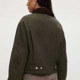 Olive Green Cotton Canvas Cropped Jacket with contrasting collar, zip-front closure, and patch pockets by Hilary Radley.