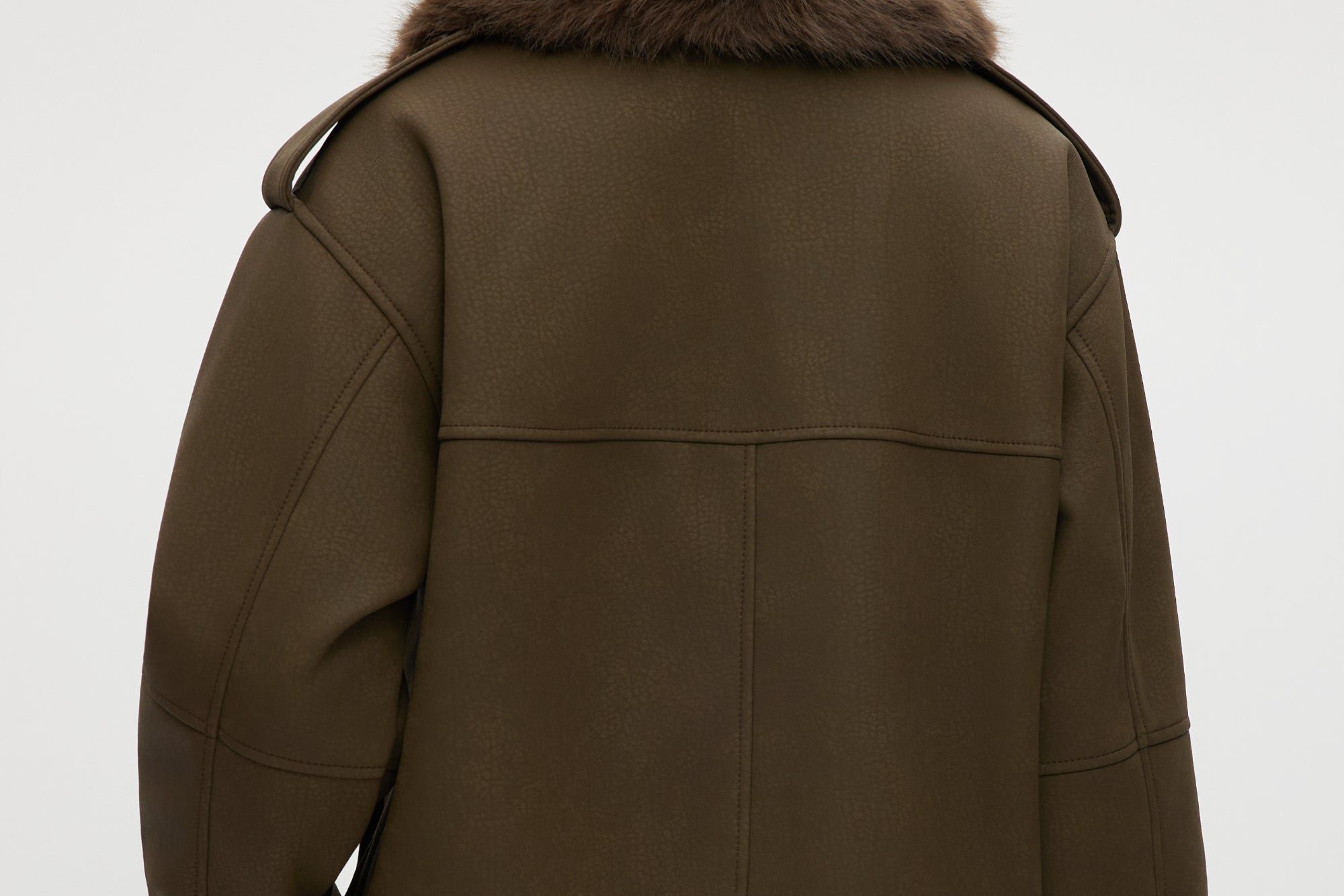 Hilary Radley Olive coated jacket featuring a removable faux fur collar, flap pockets, and ribbed hems.
