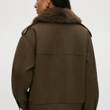 Hilary Radley Olive coated jacket featuring a removable faux fur collar, flap pockets, and ribbed hems.