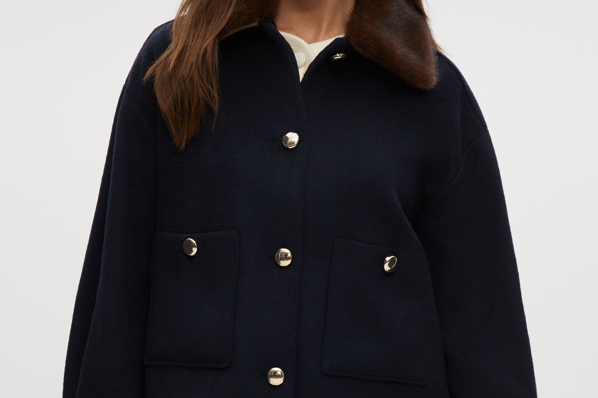 Navy wool-like jacket with removable faux fur collar and silver-tone buttons.