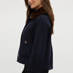 Navy wool-like boxy jacket featuring a removable faux fur collar and silver-tone buttons by Hilary Radley.