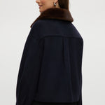 Navy wool-like boxy jacket featuring a removable faux fur collar and silver-tone buttons by Hilary Radley.