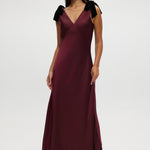 Bordeaux Satin Maxi Dress featuring velvet bow shoulder details, sleeveless design, and V-neckline by Hilary Radley.
