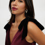 Bordeaux Satin Maxi Dress featuring elegant velvet bow shoulder details, a sleeveless design, and V-neckline by Hilary Radley.