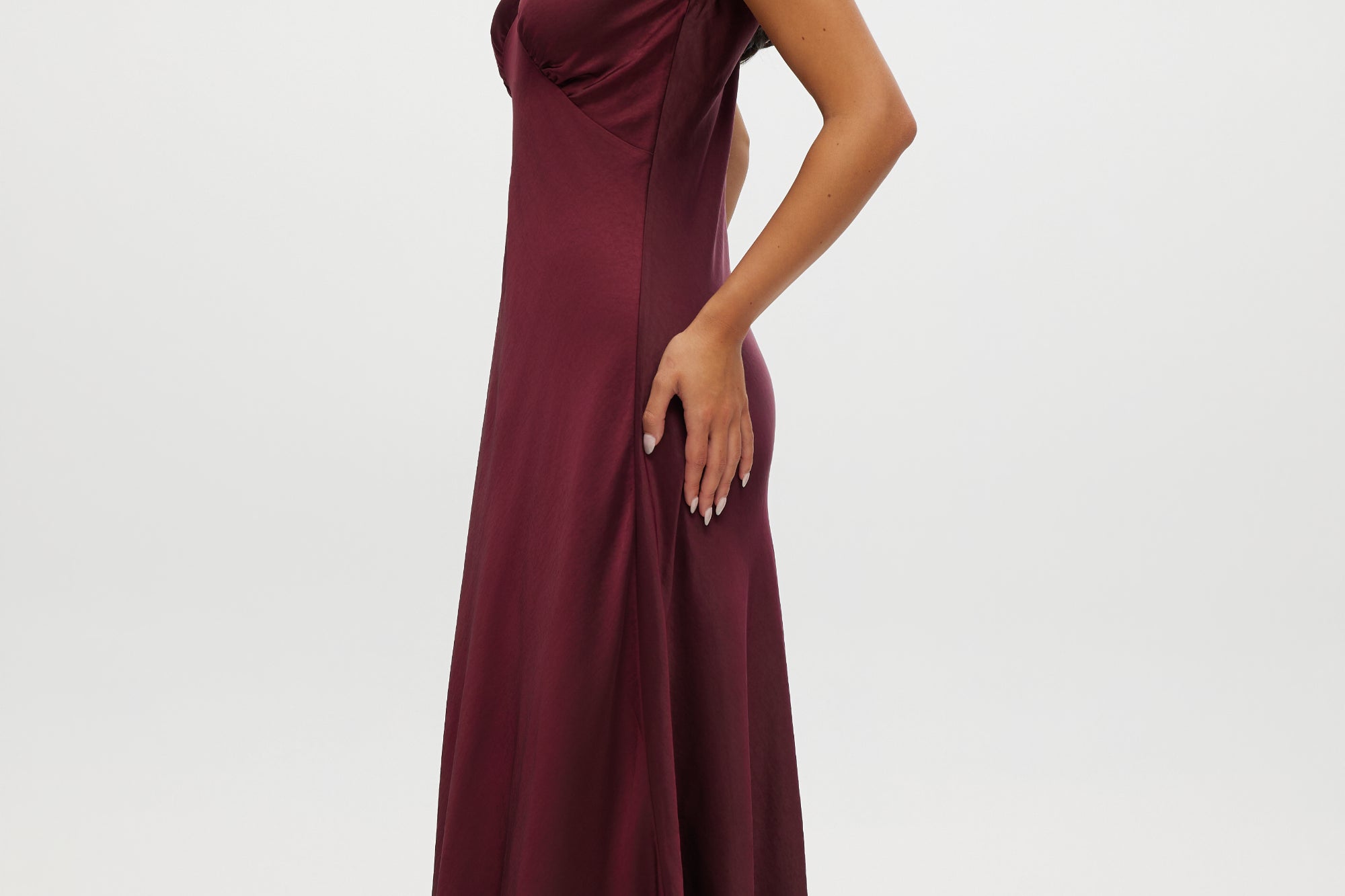 Bordeaux satin maxi dress featuring velvet bow shoulder details, sleeveless design, and V-neckline by Hilary Radley.