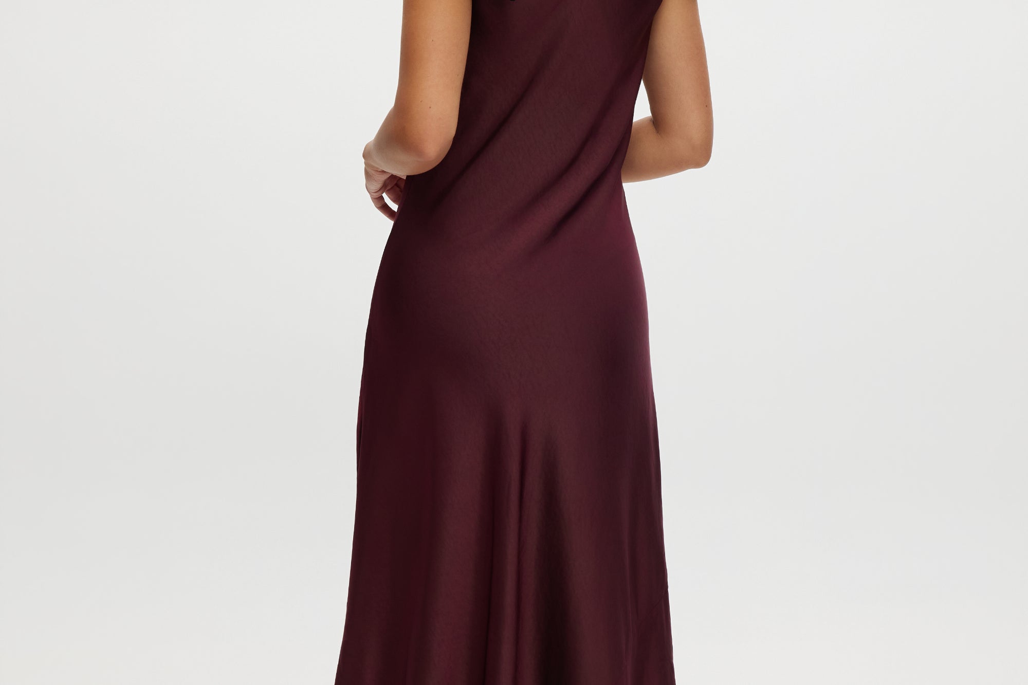 Bordeaux satin maxi dress with velvet bow shoulder details, sleeveless design, and V-neckline.
