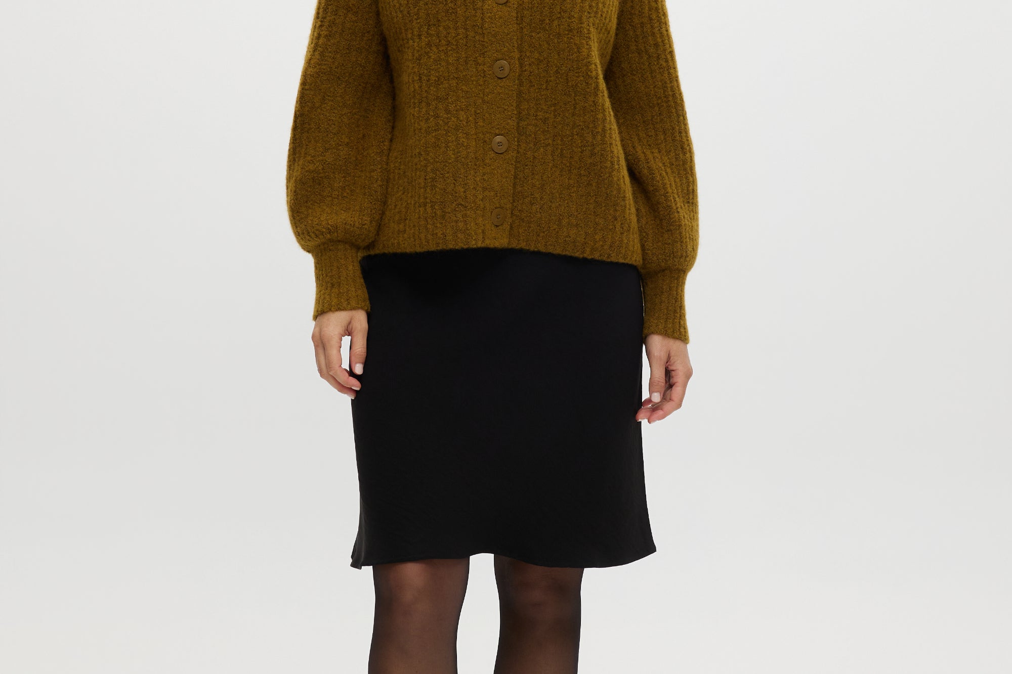 Mustard Shaker Stitch Raglan Cardigan featuring button closure and ribbed texture by Hilary Radley.