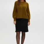 Mustard Shaker Stitch Raglan Cardigan featuring button closure and ribbed texture by Hilary Radley.