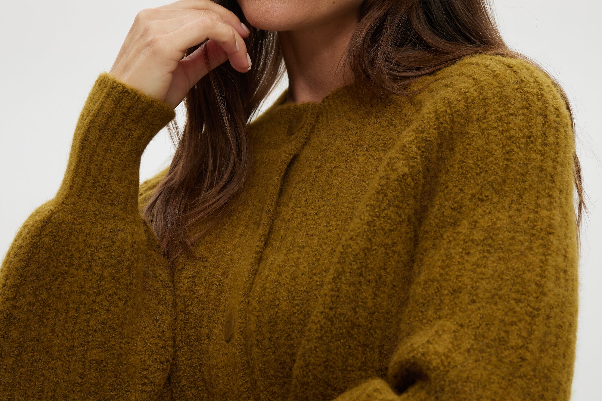 Mustard shaker stitch raglan cardigan featuring a button closure and ribbed texture by Hilary Radley.