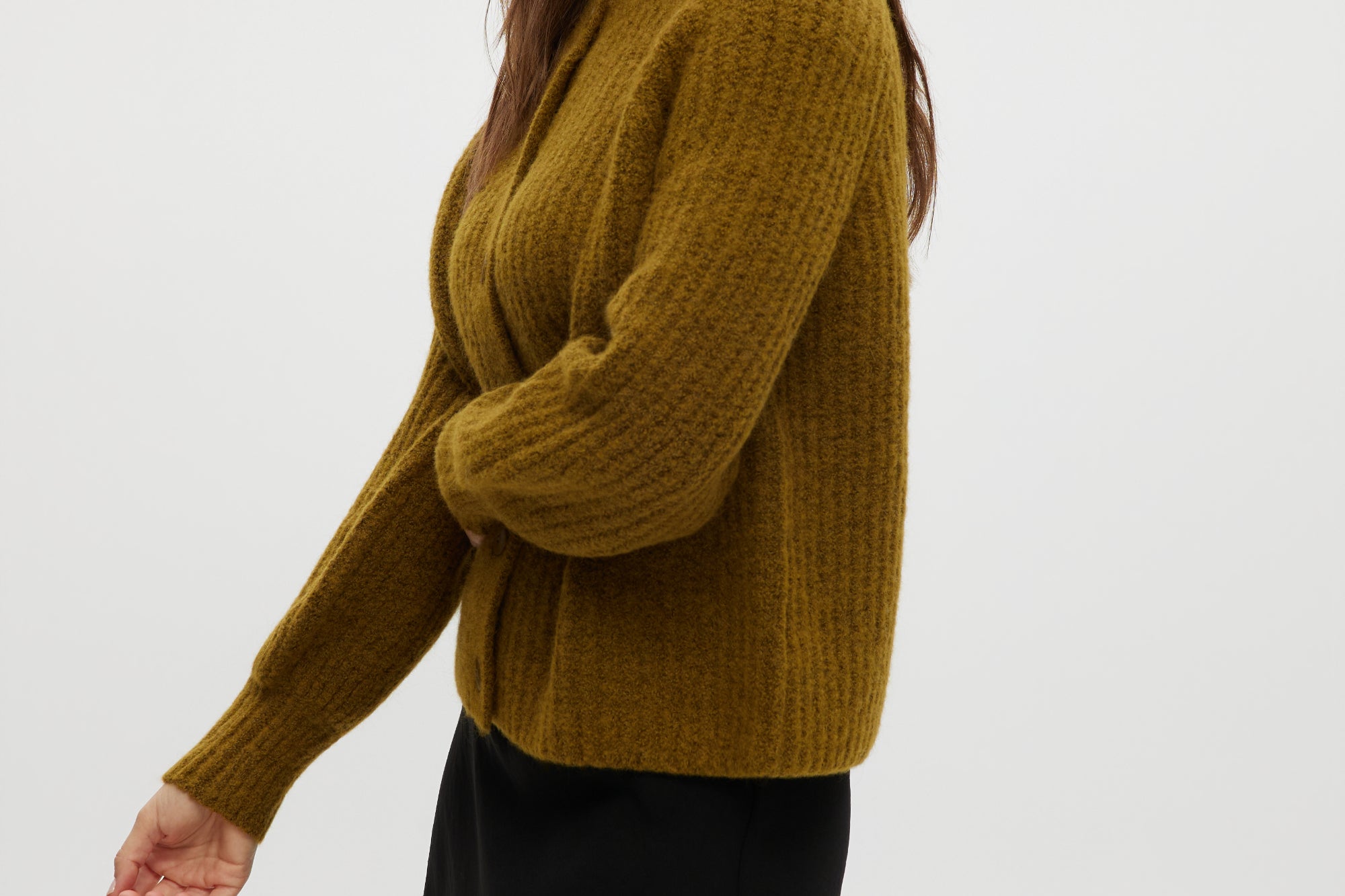 Mustard shaker stitch raglan cardigan featuring button closure and ribbed texture by Hilary Radley.