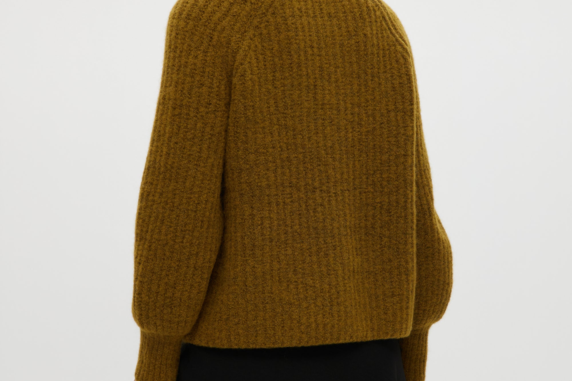 Mustard shaker stitch raglan cardigan featuring a button closure and ribbed texture by Hilary Radley.