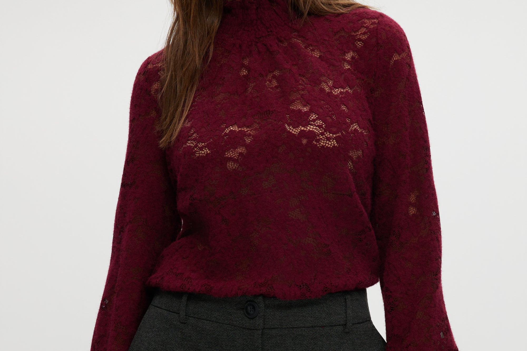 Burgundy lace top with smocked neckline and cuffs