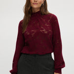 Burgundy lace top with smocked neckline and cuffs