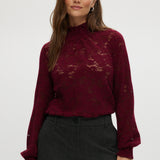 Burgundy lace top with smocked neckline and cuffs