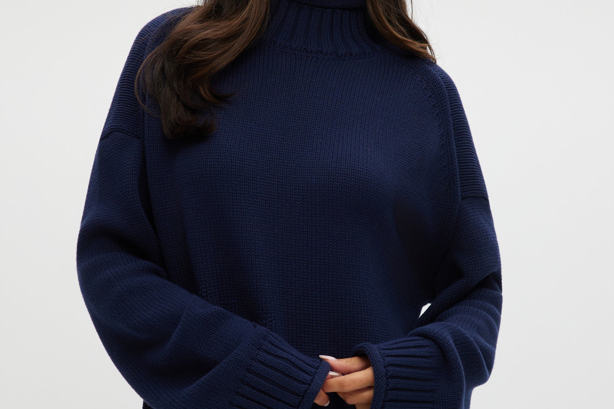Navy rolled neck cotton sweater with ribbed details and oversized fit.