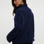 Navy rolled neck cotton sweater featuring ribbed details and an oversized fit by Hilary Radley.