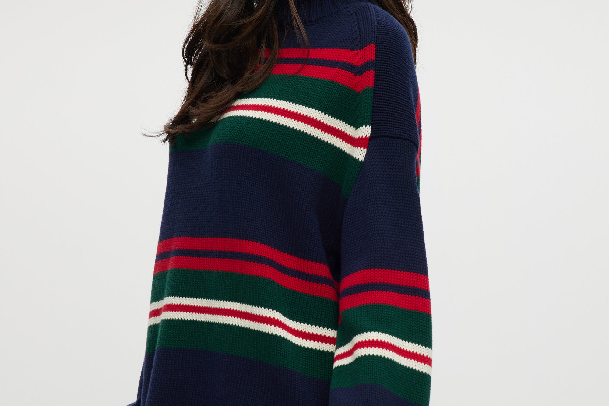 Navy Stripe Rolled Neck Sweater featuring red, green, and white stripes with a high neck and long sleeves by Hilary Radley.