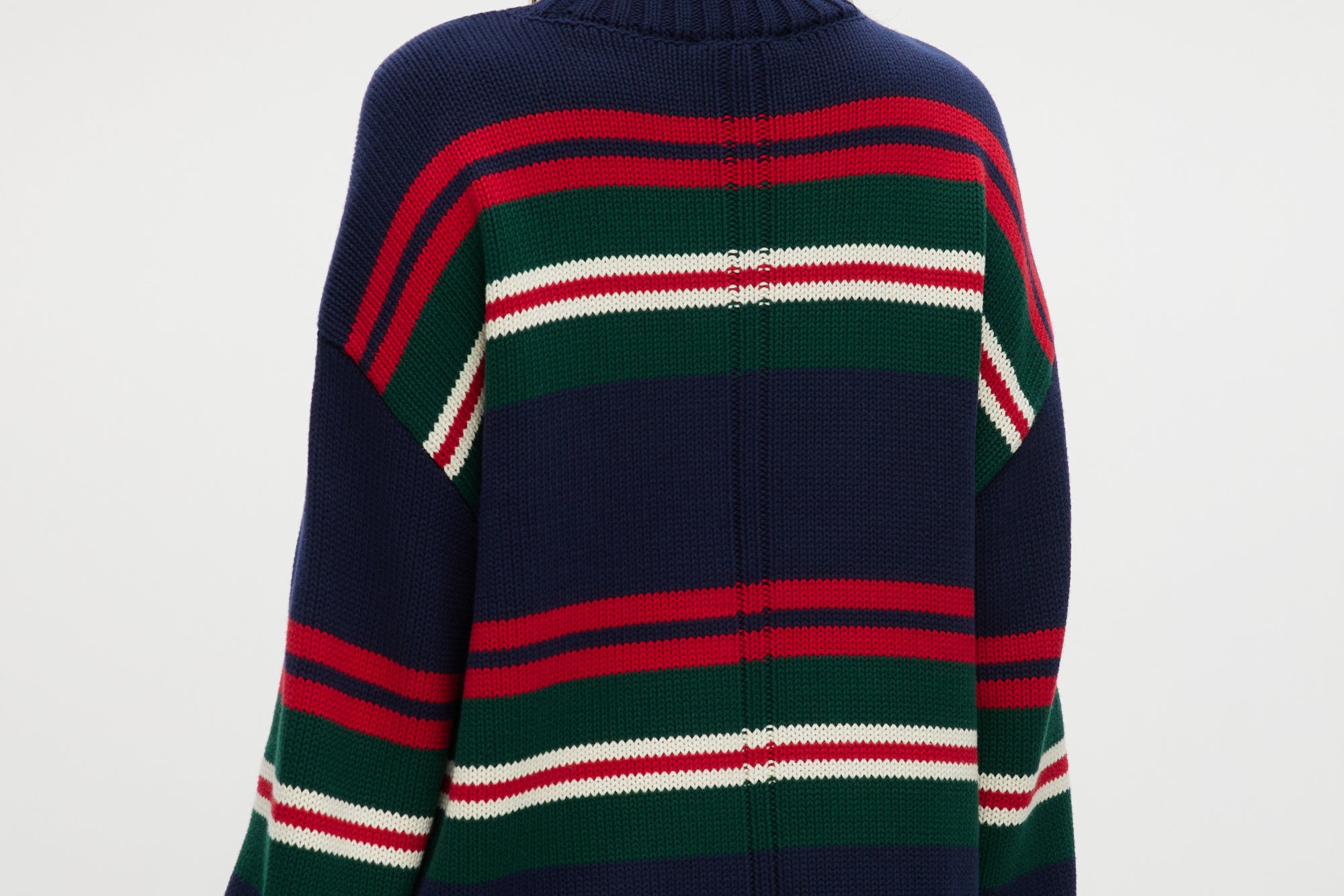 Navy Stripe Rolled Neck Sweater featuring red, green, and white stripes with a high neck and long sleeves by Hilary Radley.