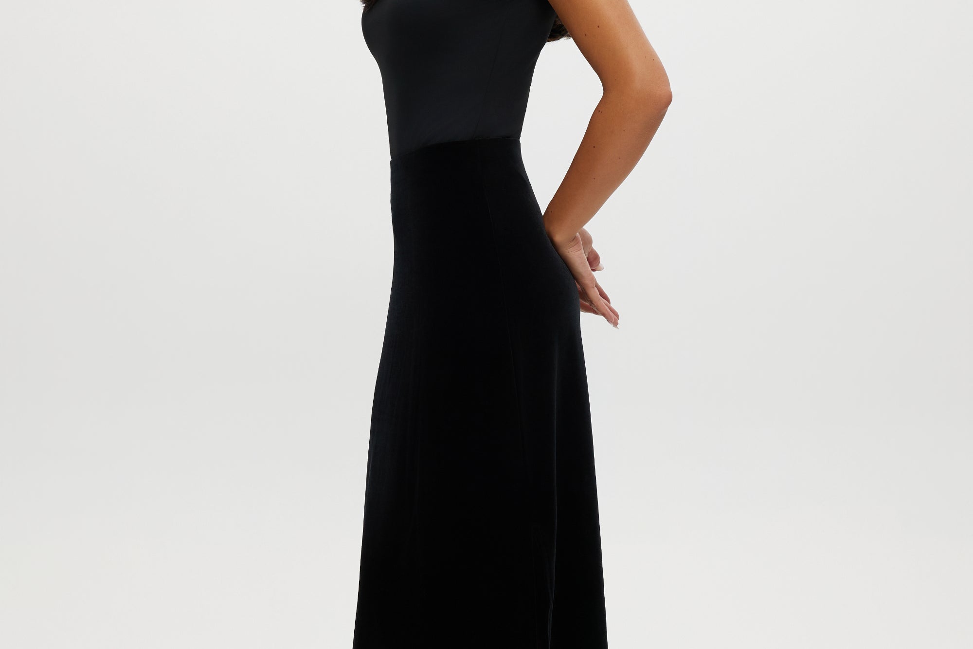 Black velvet midi skirt with elegant lace hem and pull-on design by Hilary Radley.